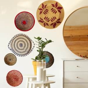 Detail of bohemian hand-woven wall baskets with intricate seagrass textures and patterns