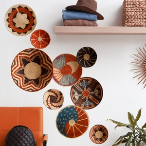 Bohemian seagrass wall decor baskets in warm orange and brown tones for living room