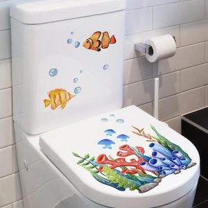 Vibrant sea life toilet decals featuring clownfish and jellyfish on a white ceramic base