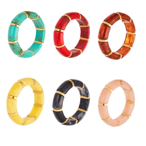 Elastic resin bamboo tube bracelets in various colors with golden spacers on white background