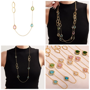 Dettaglio della collana con cristalli a goccia colorati con catena d'oro e gemme sfaccettate