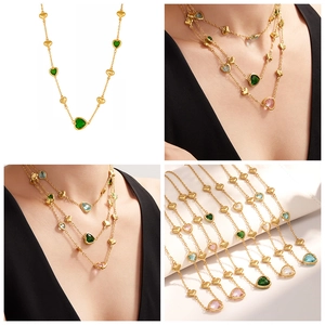 Detail of 18k gold plated stainless steel necklaces with heart-shaped glass stones