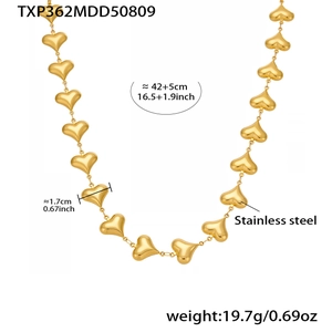 Detail view of gold hollow heart link necklace in stainless steel with size dimensions