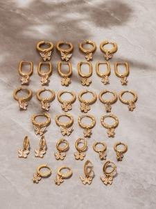 Collection détaillée de boucles d'oreilles papillon plaqué or 18k avec zircone brillant