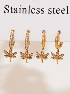 Detail of gold dragonfly earring set with cubic zirconia pave on stainless steel