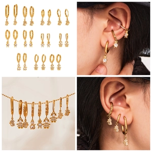Detailed views of gold earrings set featuring bear and squirrel 5A zircon charms