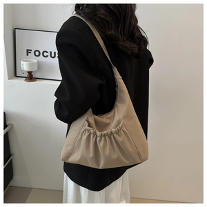 Beige pleated PU leather shoulder bag featuring large capacity and stylish ruched detail
