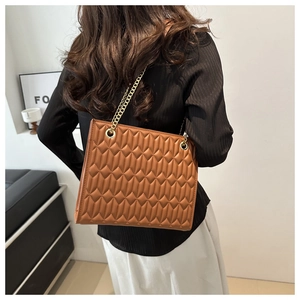 Brown quilted leather tote bag with elegant gold chain strap for stylish office wear