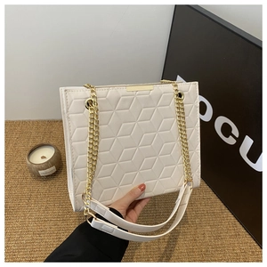 Beige quilted chain shoulder bag with minimalist geometric pattern and gold hardware