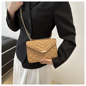 Quilted light brown crossbody bag with gold chain strap and V-pattern flap detail