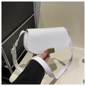 Detail of white saddle bag with fine leather texture and golden metallic buckle
