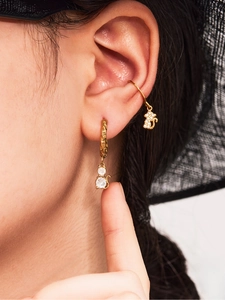 Macro shot of 18k gold plated cat earrings with sparkling 5A cubic zirconia stones