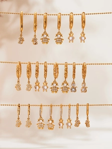 Detailed display of 18k gold plated hoop earrings with 5A zircon animal charms