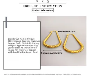 Detail view of gold fan-shaped brass earrings with 18K plating and size measurements