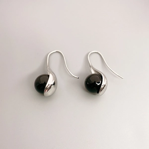 Elegant silver-tone brass drop earrings featuring round black onyx and hook design