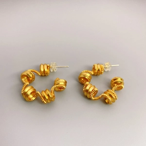 18K gold plated spring spiral stud earrings with textured industrial design style