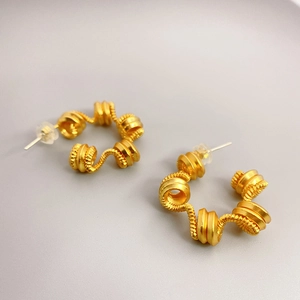 18K gold plated spiral spring earrings with S925 silver needles and artistic wave design