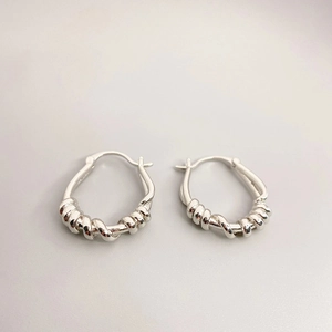 Minimalist twisted rope hoop earrings in 18K gold plated brass with drop shape