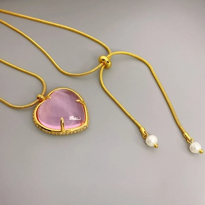 Pink heart crystal pendant necklace with gold snake chain and zircon setting