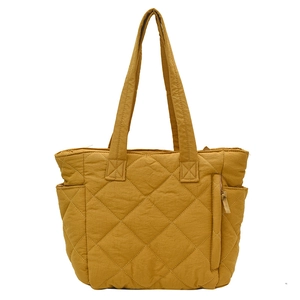 Quilted nylon tote bag in ginger yellow with large capacity and multi-pocket design