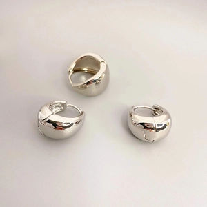 Polished silver chunky hoop earrings with glossy finish and secure hinged closure