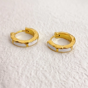 Chunky 18K gold plated huggie earrings with textured metal and white enamel inlay
