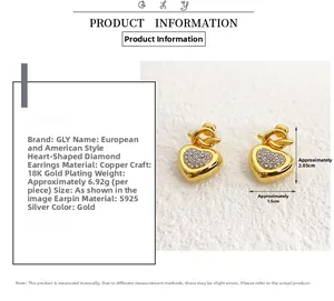 Detail of heart-shaped gold earrings with fine crystals and 18K gold plating finish