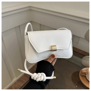 Minimalist white leather crossbody bag with golden square buckle and knot strap detail
