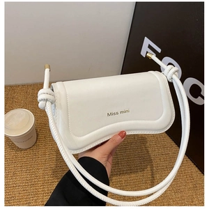 Elegant white leather crossbody bag with gold lettering and stylish knotted shoulder strap