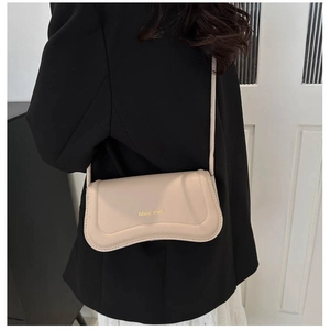 Modern apricot shoulder bag with wave-shaped bottom and gold Miss mini logo
