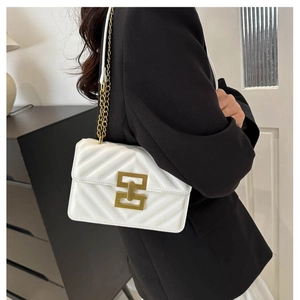 White quilted crossbody bag with V-shaped stitching and golden chain strap for women