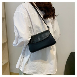Classic black PU leather crossbody bag with faux crocodile pattern and flap design