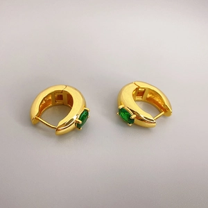 Elegant gold-plated hoop earrings featuring claw-set oval green zircon gemstones