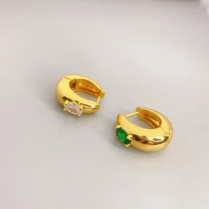 Chunky gold-plated hoop earrings featuring white and emerald green oval zircon stones