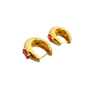 Elegant gold plated hoop earrings with oval red zircon stones on a clean white background