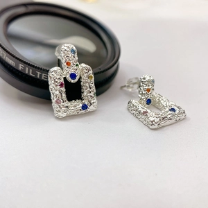 Retro irregular texture silver stud earrings with colorful gemstones and lava design