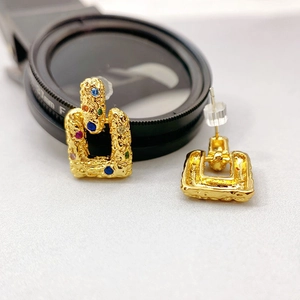 Irregular texture gold stud earrings featuring multi-color gemstones with artistic lava finish