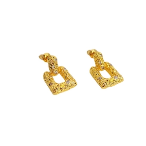 Gold lava texture rectangular drop earrings with zircon accents on a clean white background