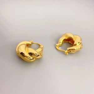 Polished gold twisted double strand hoop earrings for women in minimalist metal design