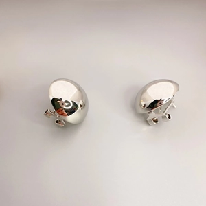 Polished silver hemispherical clip-on earrings with a minimalist metallic mirror finish