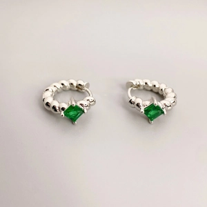 Silver twisted hoop earrings with square-cut green gemstone center in a four-prong setting