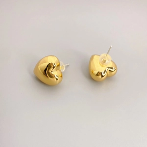 Minimalist golden heart stud earrings with a high-polished finish and silicone backings