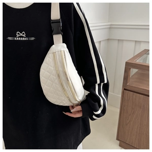 White quilted nylon saddle bag for women with dual gold zippers and crossbody strap