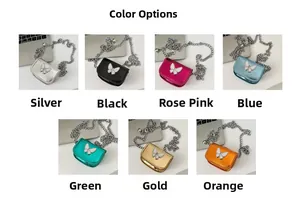 Detailed view of mini chain bags in seven metallic colors with butterfly decorations
