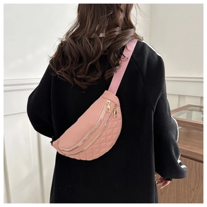 Pink quilted nylon saddle bag for women with gold zippers and adjustable shoulder strap