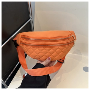 Bright orange nylon saddle bag with diamond quilting and adjustable shoulder strap