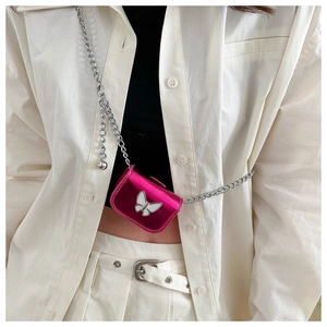 Mini metallic rose pink crossbody bag with white butterfly motif and silver chain strap