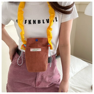 Brown corduroy crossbody phone bag for women with stylish yellow ruffled shoulder strap