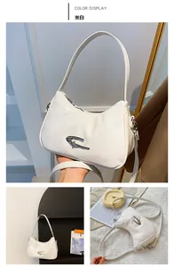 Detail of off-white hobo bag showing glossy patent leather texture and metallic logo