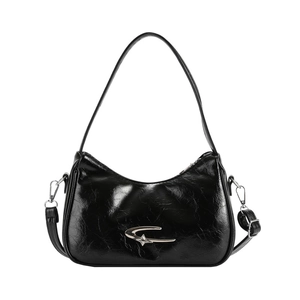 2024 Crescent Hobo Bag in black patent leather with silver star metal decoration